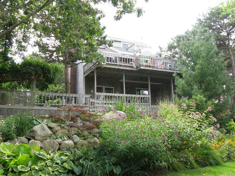 20 Massasoit Road Wellfleet, MA 02667 - Photo 2 of 35 a house view with a garden space