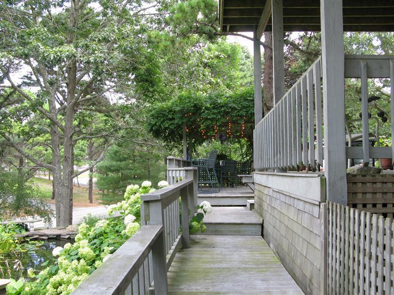 20 Massasoit Road Wellfleet, MA 02667 - Photo 21 of 35 a view of a pathway of a house with wooden fence
