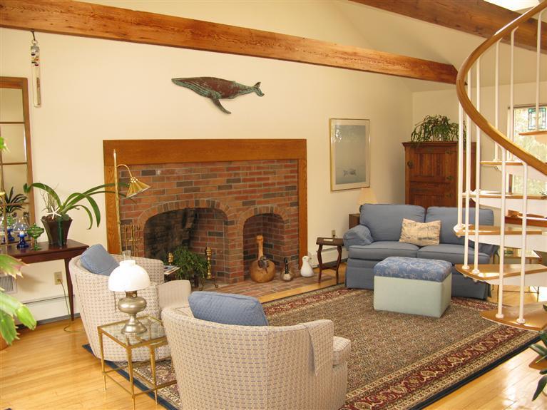 20 Massasoit Road Wellfleet, MA 02667 - Photo 5 of 35 a living room with furniture and a fireplace