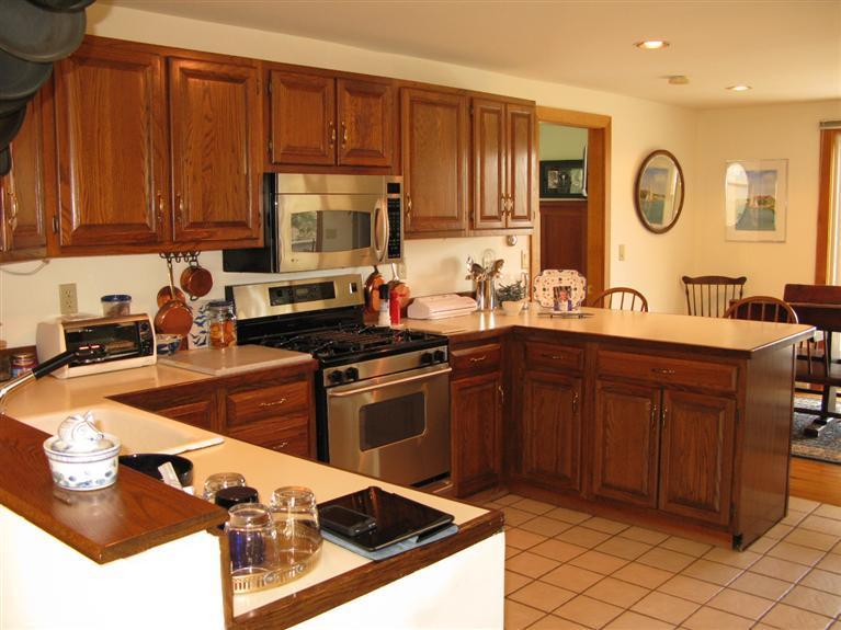 20 Massasoit Road Wellfleet, MA 02667 - Photo 8 of 35 a kitchen with stainless steel appliances granite countertop a sink stove and cabinets