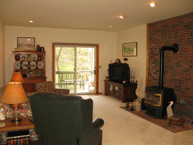 20 Massasoit Road Wellfleet, MA 02667 - Photo 10 of 35 a living room with furniture windows and a flat screen tv