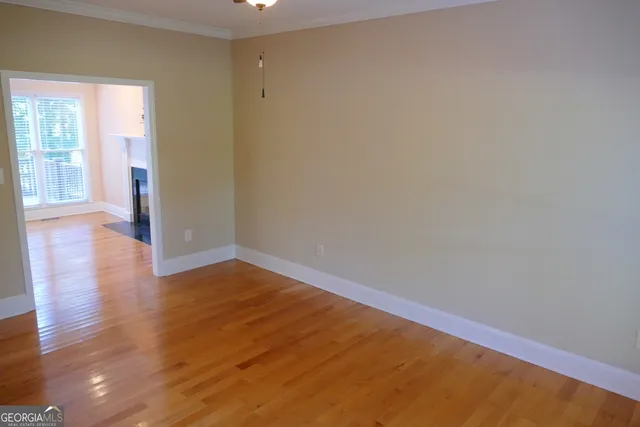 a view of hallway with wooden floor
