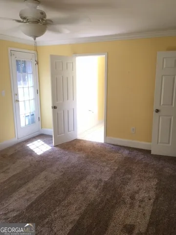 a view of an empty room and window