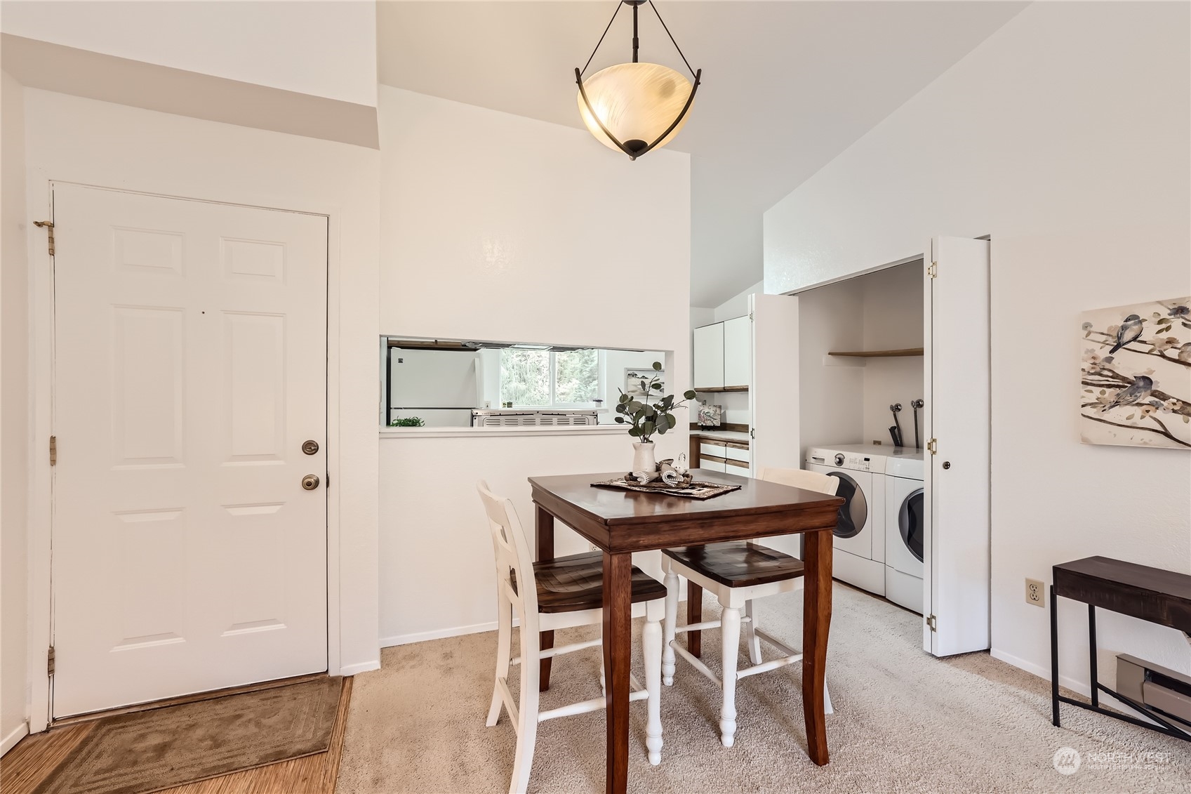 10830 East Riverside Drive, Unit B301 Bothell, WA 98011 - Photo 6 of 11 a view of a dining room with furniture