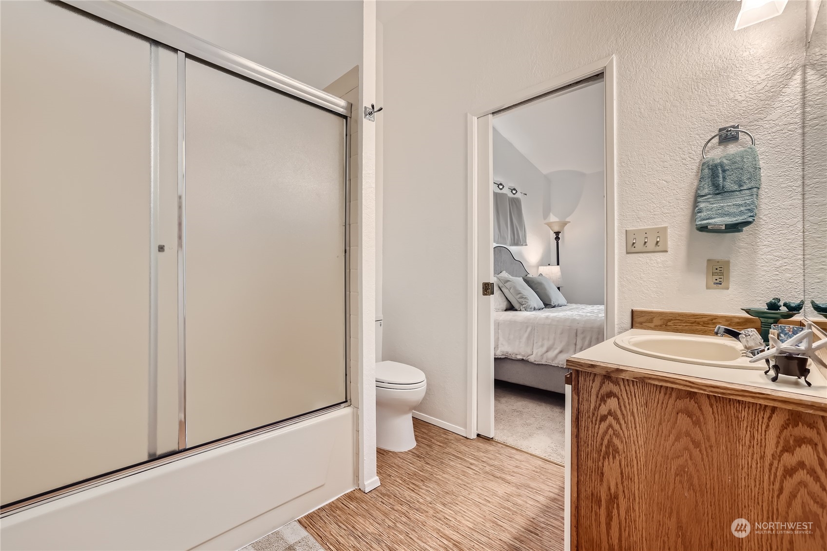 10830 East Riverside Drive, Unit B301 Bothell, WA 98011 - Photo 8 of 11 a spacious bathroom with a sink and a mirror