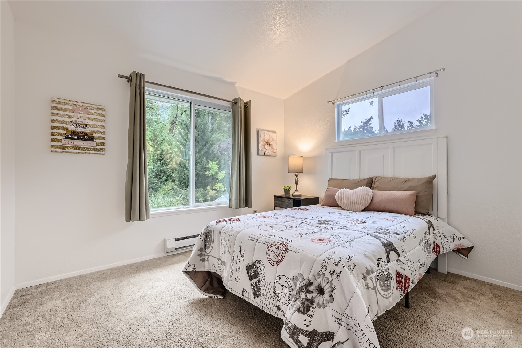 10830 East Riverside Drive, Unit B301 Bothell, WA 98011 - Photo 9 of 11 a bedroom with a bed and a window