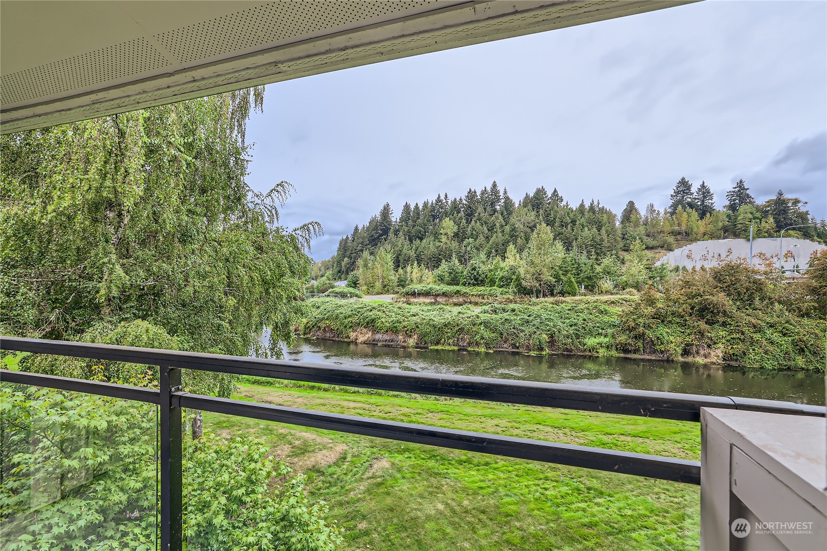 10830 East Riverside Drive, Unit B301 Bothell, WA 98011 - Photo 10 of 11 a view of outdoor space and a lake view