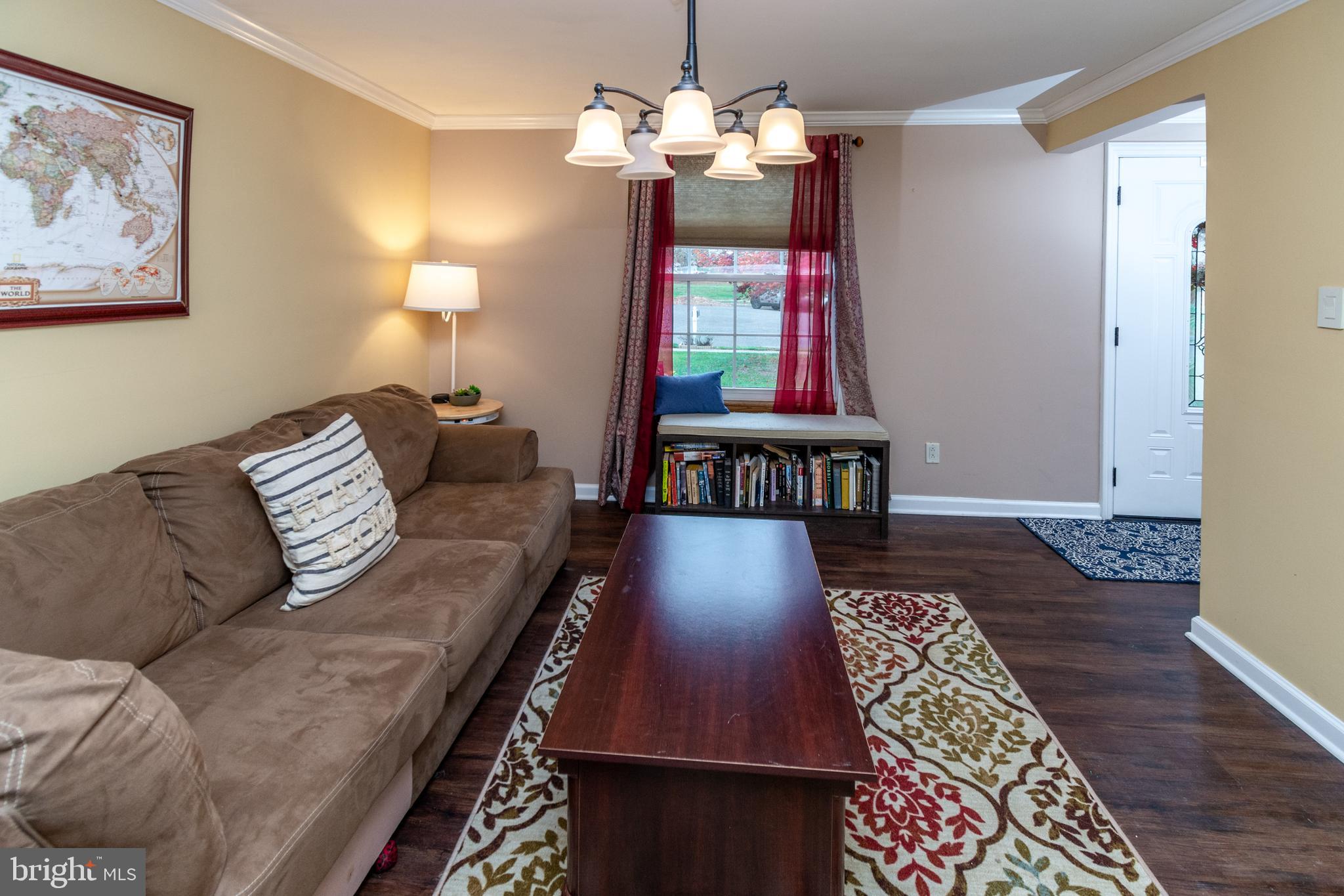 7 Pinehurst Court Hamilton, NJ 08690 - Photo 12 of 52 a living room with furniture and a chandelier
