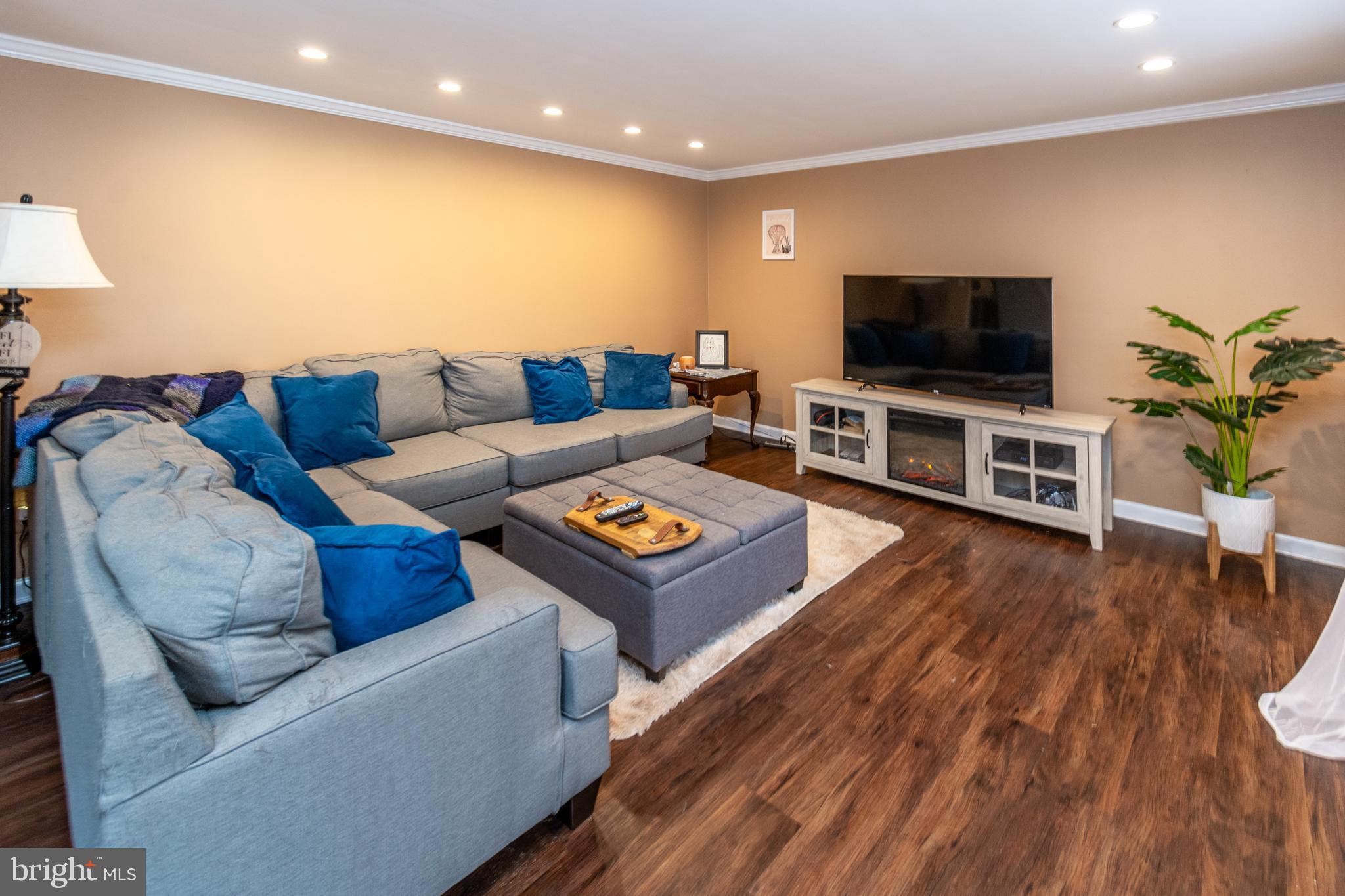 7 Pinehurst Court Hamilton, NJ 08690 - Photo 15 of 52 a living room with furniture and a flat screen tv
