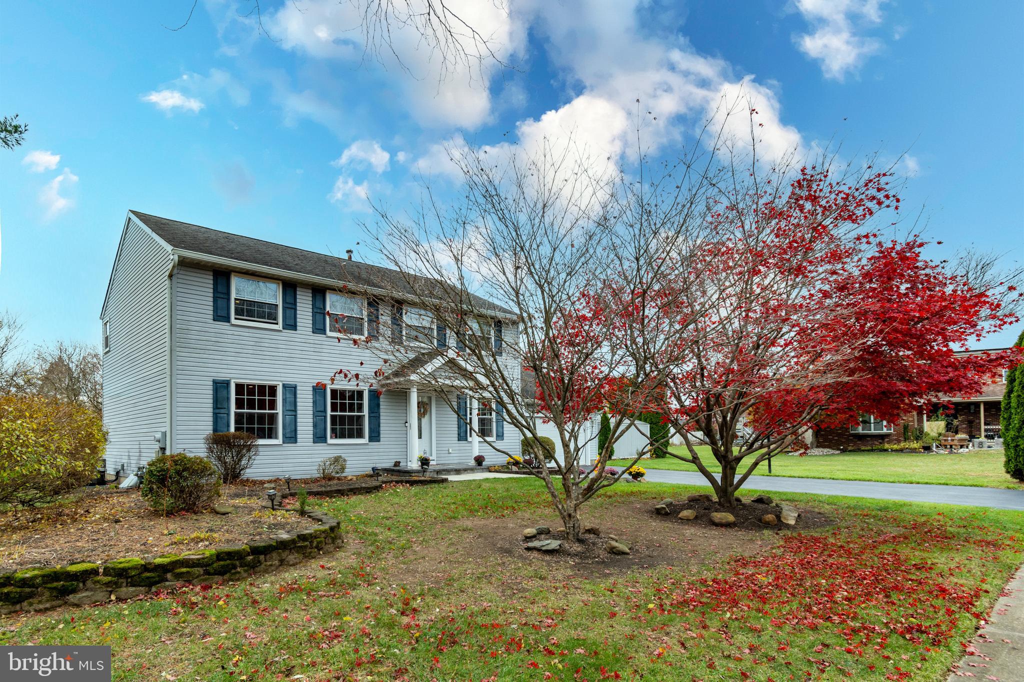 7 Pinehurst Court Hamilton, NJ 08690 - Photo 2 of 52 a front view of a house with a garden and trees