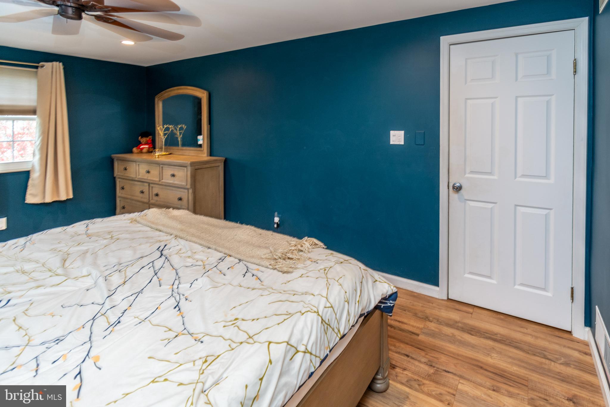 7 Pinehurst Court Hamilton, NJ 08690 - Photo 27 of 52 a bedroom with a bed and a chandelier