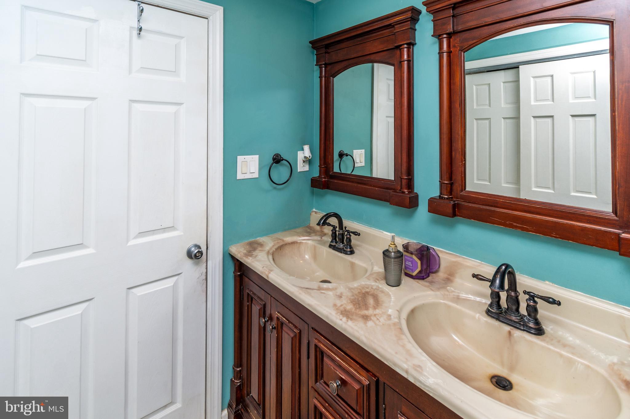 7 Pinehurst Court Hamilton, NJ 08690 - Photo 38 of 52 a bathroom with a sink and a mirror