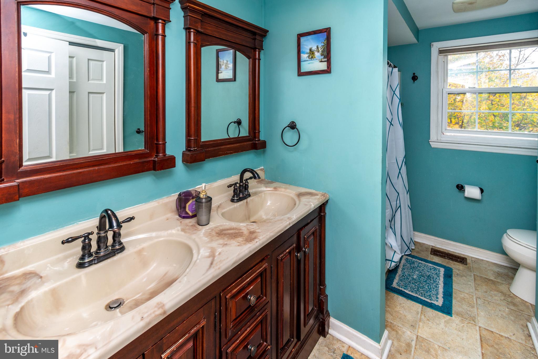 7 Pinehurst Court Hamilton, NJ 08690 - Photo 39 of 52 a bathroom with a sink double vanity and a toilet