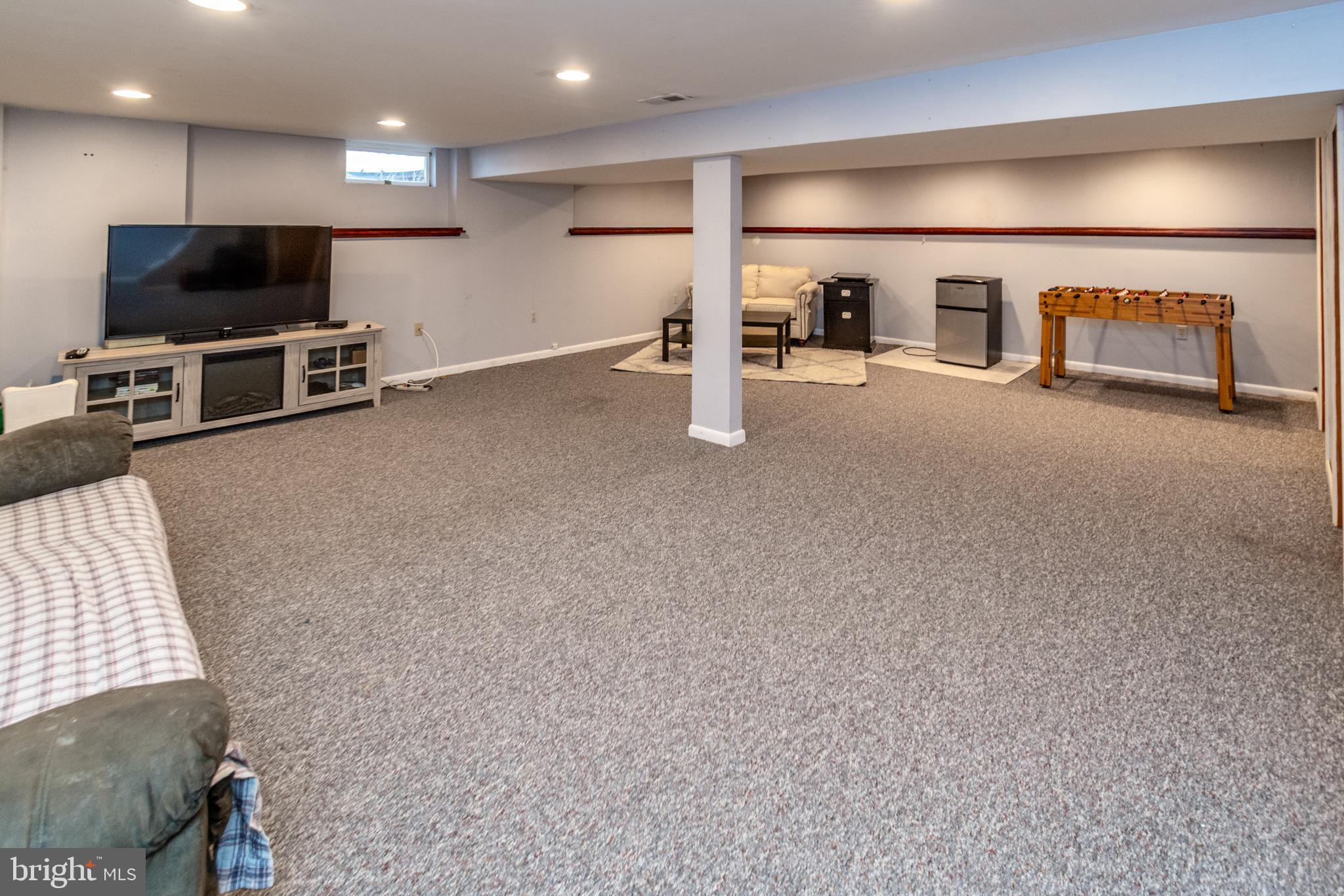 7 Pinehurst Court Hamilton, NJ 08690 - Photo 42 of 52 a view of a livingroom with furniture and a flat screen tv