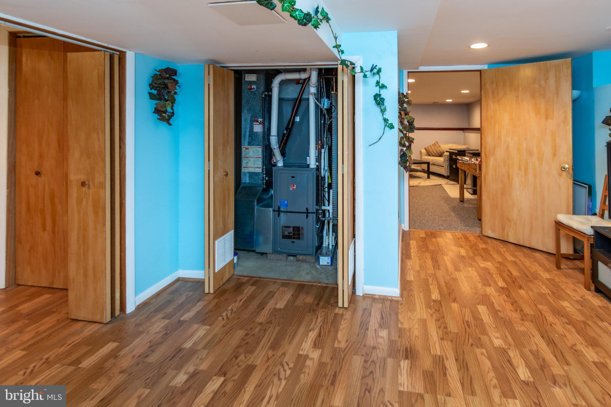 7 Pinehurst Court Hamilton, NJ 08690 - Photo 45 of 52 a view of a hallway with wooden floor and a bathroom