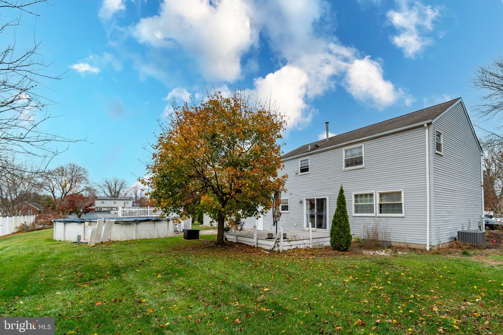7 Pinehurst Court Hamilton, NJ 08690 - Photo 51 of 52 a view of a backyard with plants and large trees