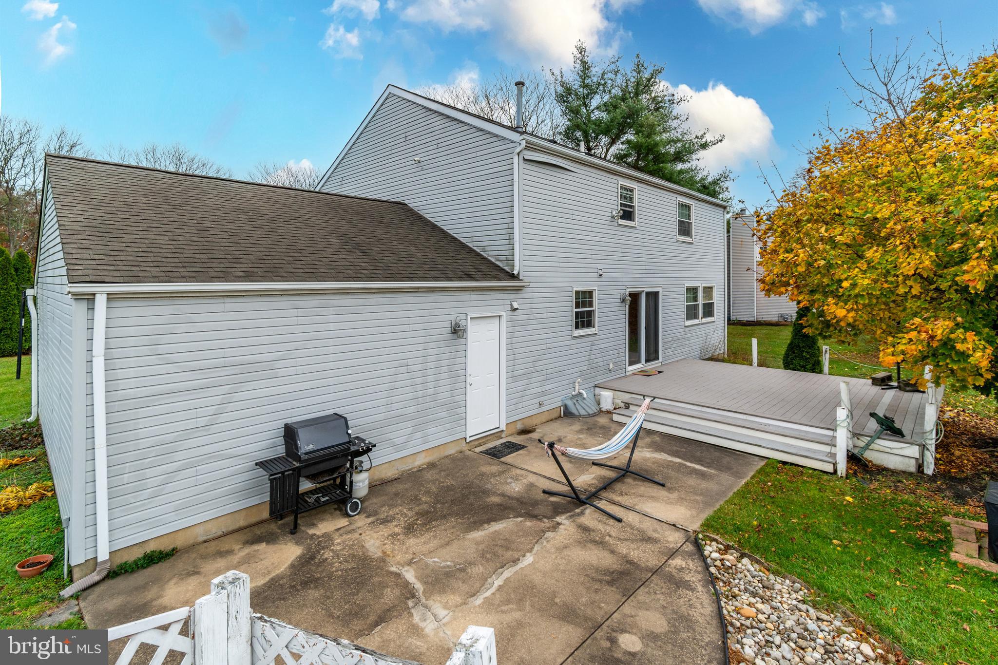 7 Pinehurst Court Hamilton, NJ 08690 - Photo 52 of 52 a backyard of a house with table and chairs