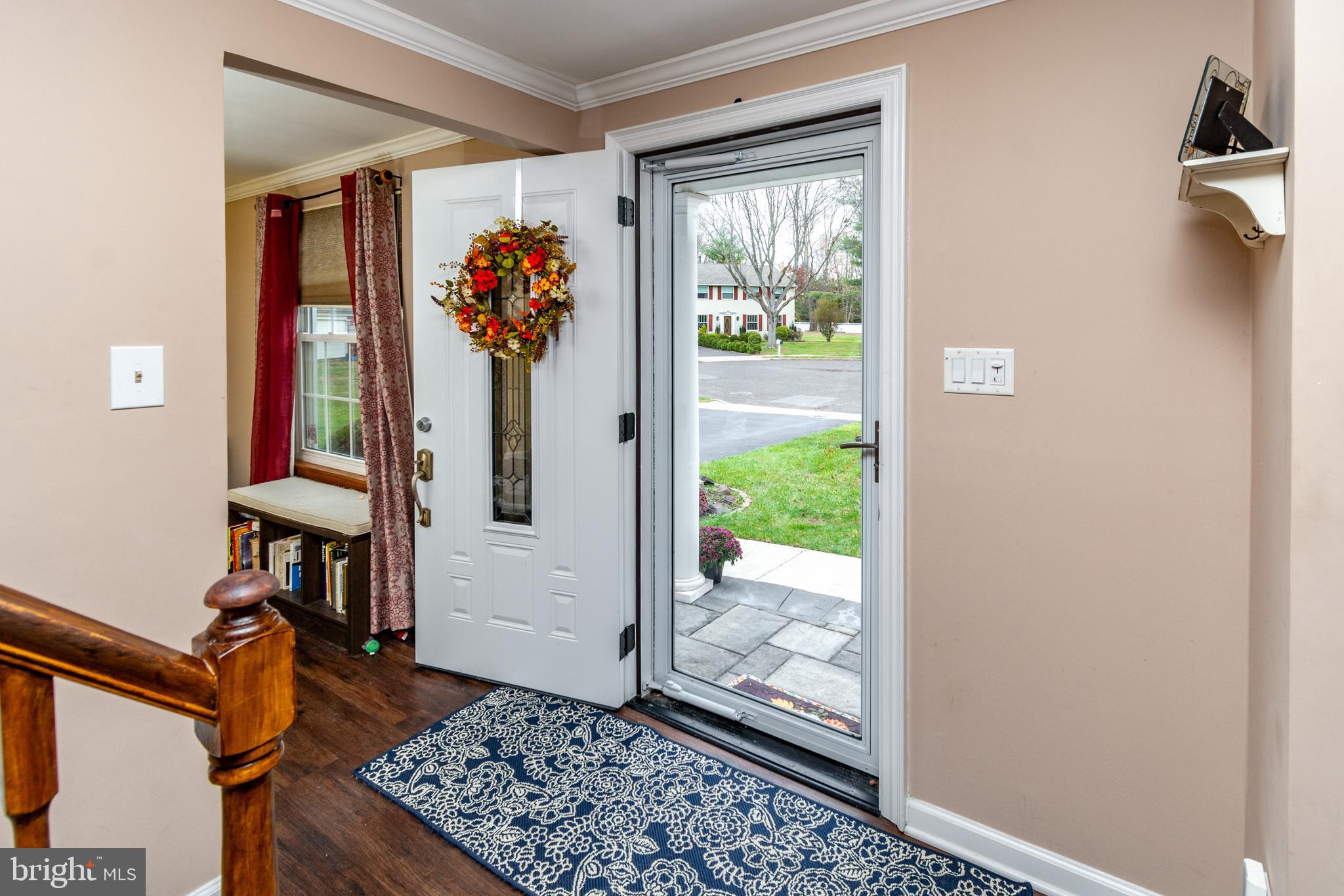 7 Pinehurst Court Hamilton, NJ 08690 - Photo 7 of 52 a view of a hallway with wooden floor and a potted plant