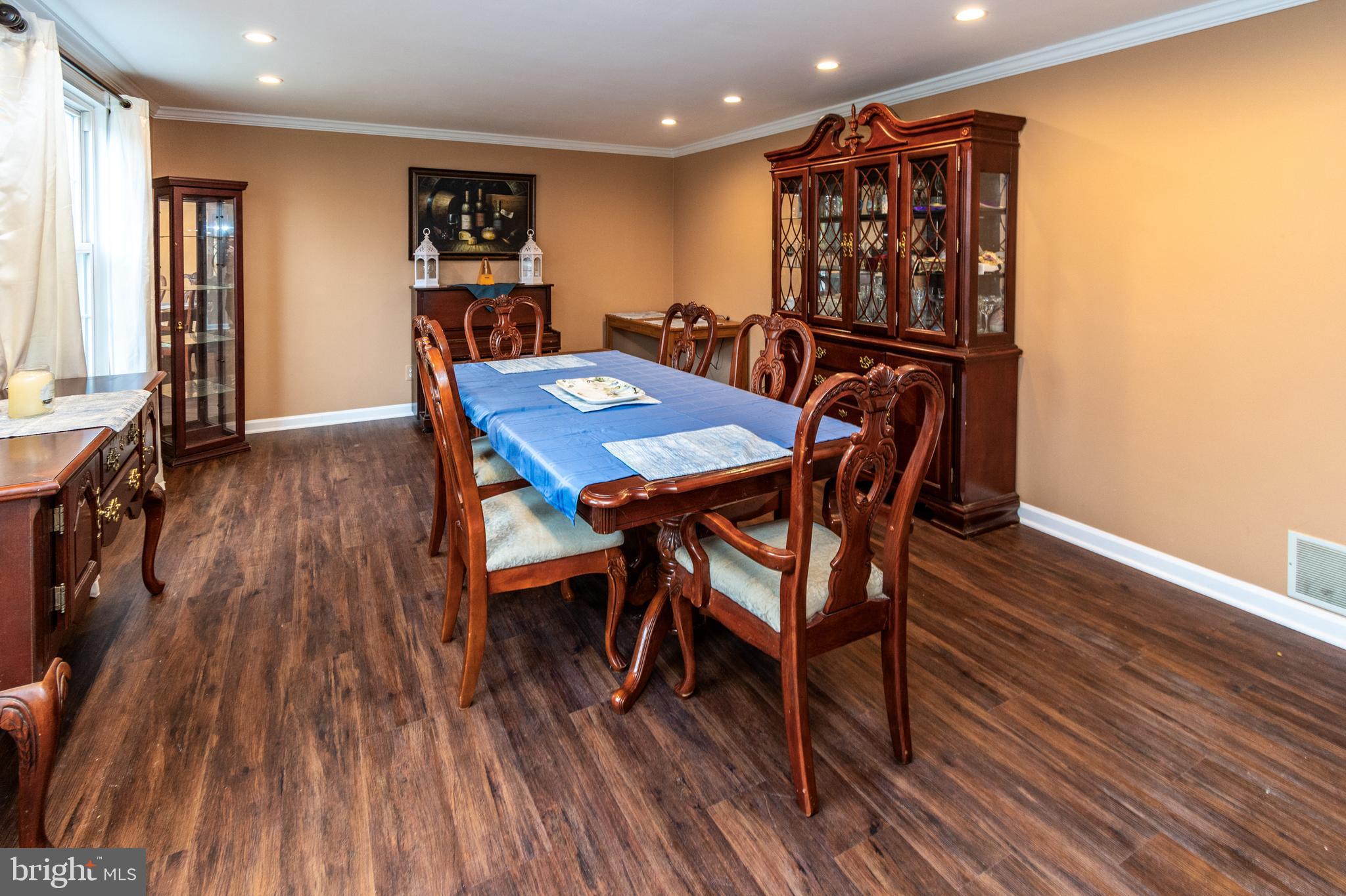 7 Pinehurst Court Hamilton, NJ 08690 - Photo 10 of 52 a view of a dining room with furniture and wooden floor