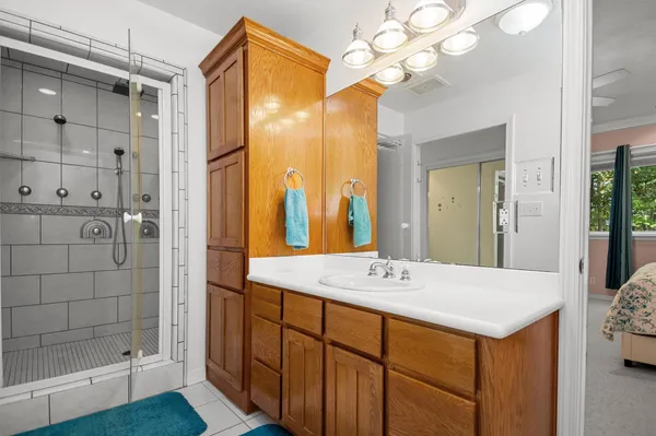 a bathroom with a sink and a mirror
