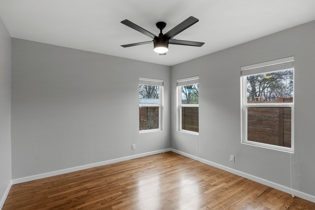 3404 Touchstone Street Austin, TX 78723 - Photo 17 of 32 Empty room featuring light wood-style flooring and a ceiling fan