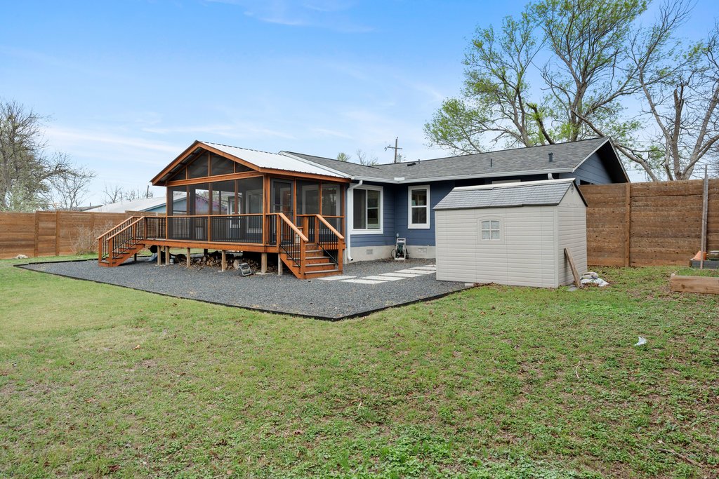 3404 Touchstone Street Austin, TX 78723 - Photo 30 of 32 Back of house featuring a sunroom, a fenced backyard, a shed, a deck, and crawl space