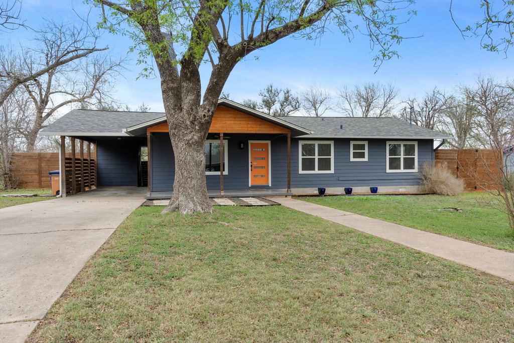 3404 Touchstone Street Austin, TX 78723 - Photo 4 of 32 Ranch-style home with a carport, concrete driveway, a porch, and roof with shingles