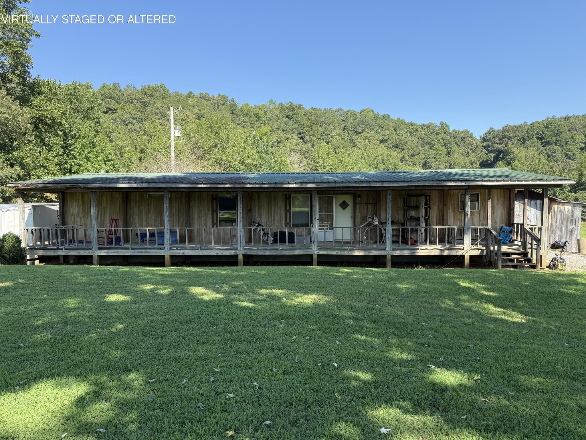975 Welch Lane Dunlap, TN 37327 - Photo 12 of 22 a view of a house with a yard and sitting area