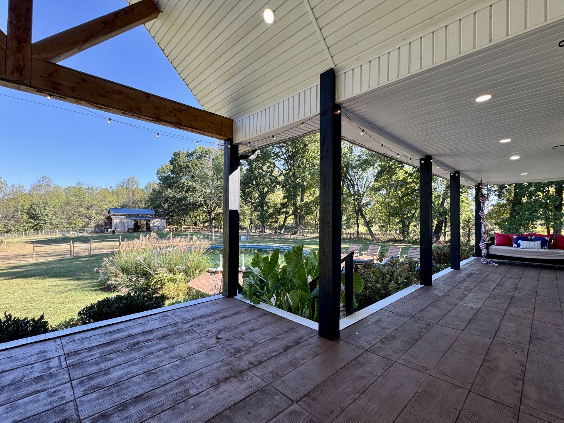418 Creekmore Road Cottontown, TN 37048 - Photo 27 of 60 a view of a balcony with lake view and a floor to ceiling window