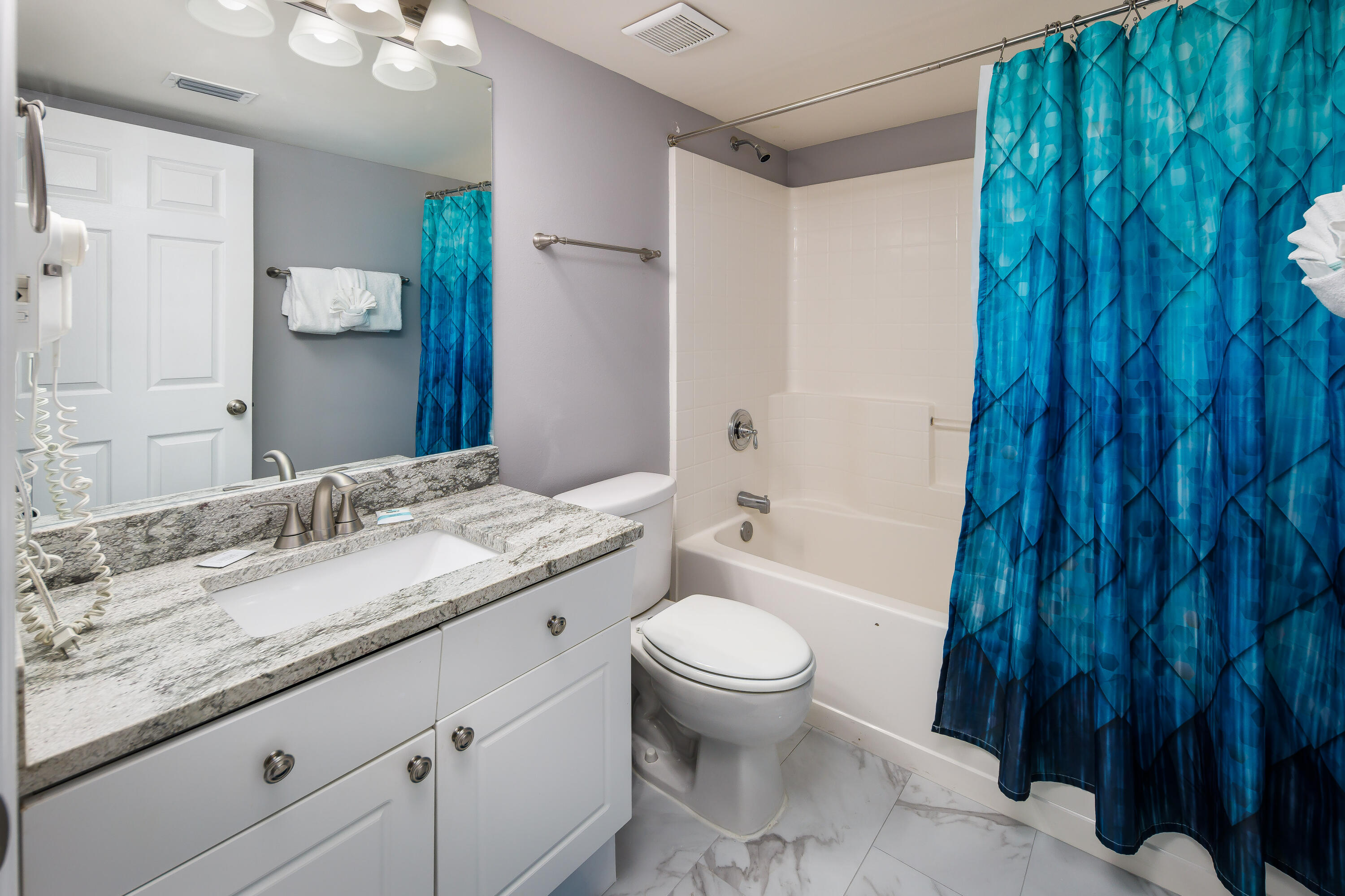 895 Santa Rosa Boulevard, Unit 208 Fort Walton Beach, FL 32548 - Photo 11 of 21 a bathroom with a granite countertop sink toilet and shower