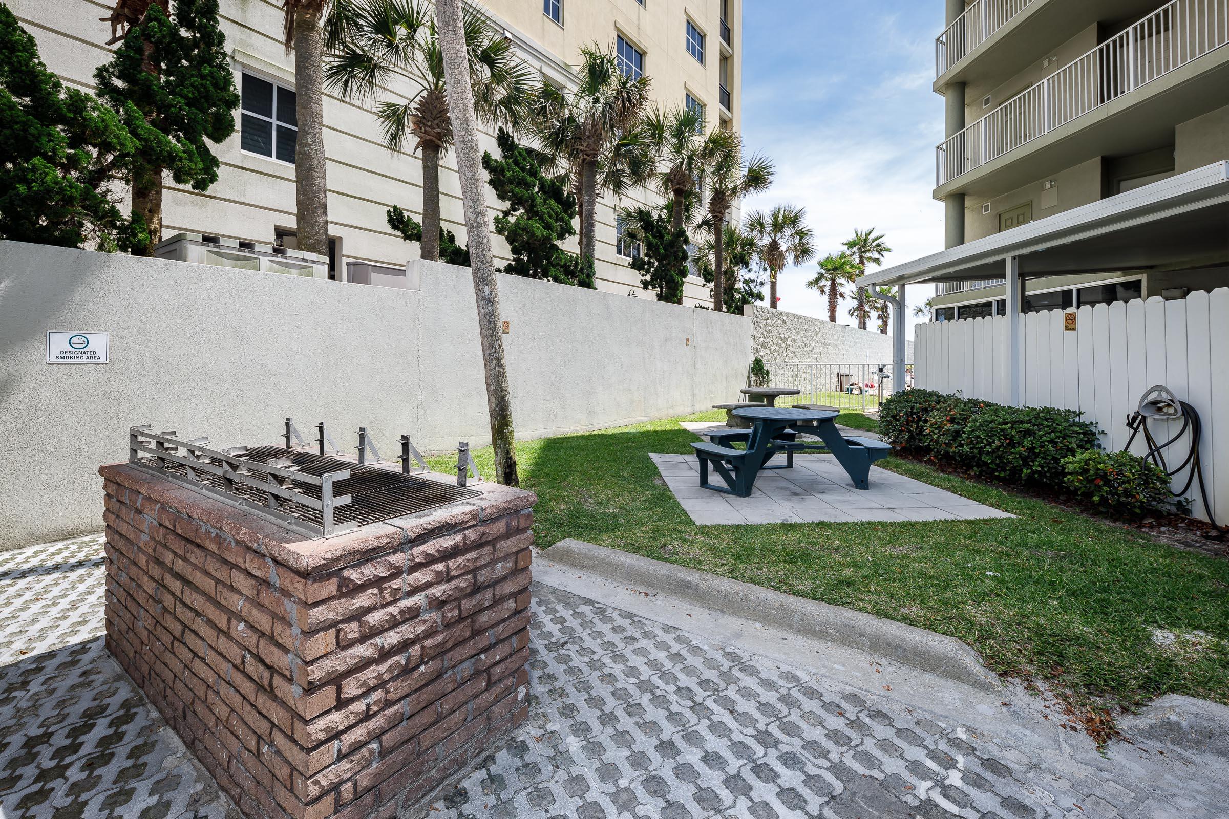 895 Santa Rosa Boulevard, Unit 208 Fort Walton Beach, FL 32548 - Photo 19 of 21 a view of a patio with chair and tables