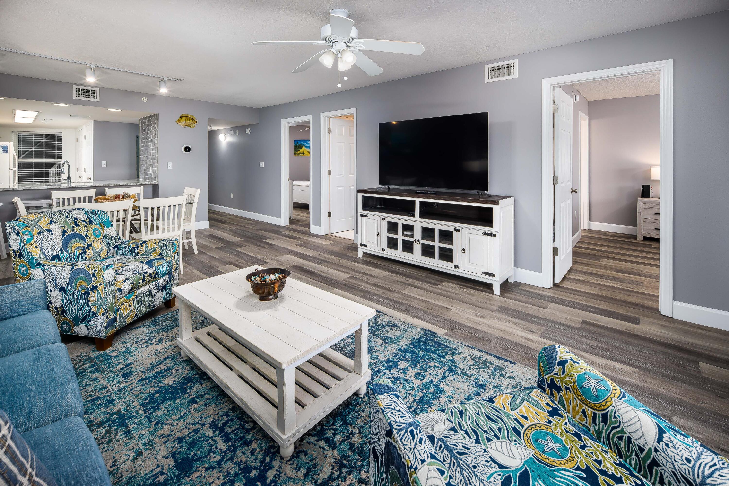 895 Santa Rosa Boulevard, Unit 208 Fort Walton Beach, FL 32548 - Photo 3 of 21 a living room with furniture and a flat screen tv