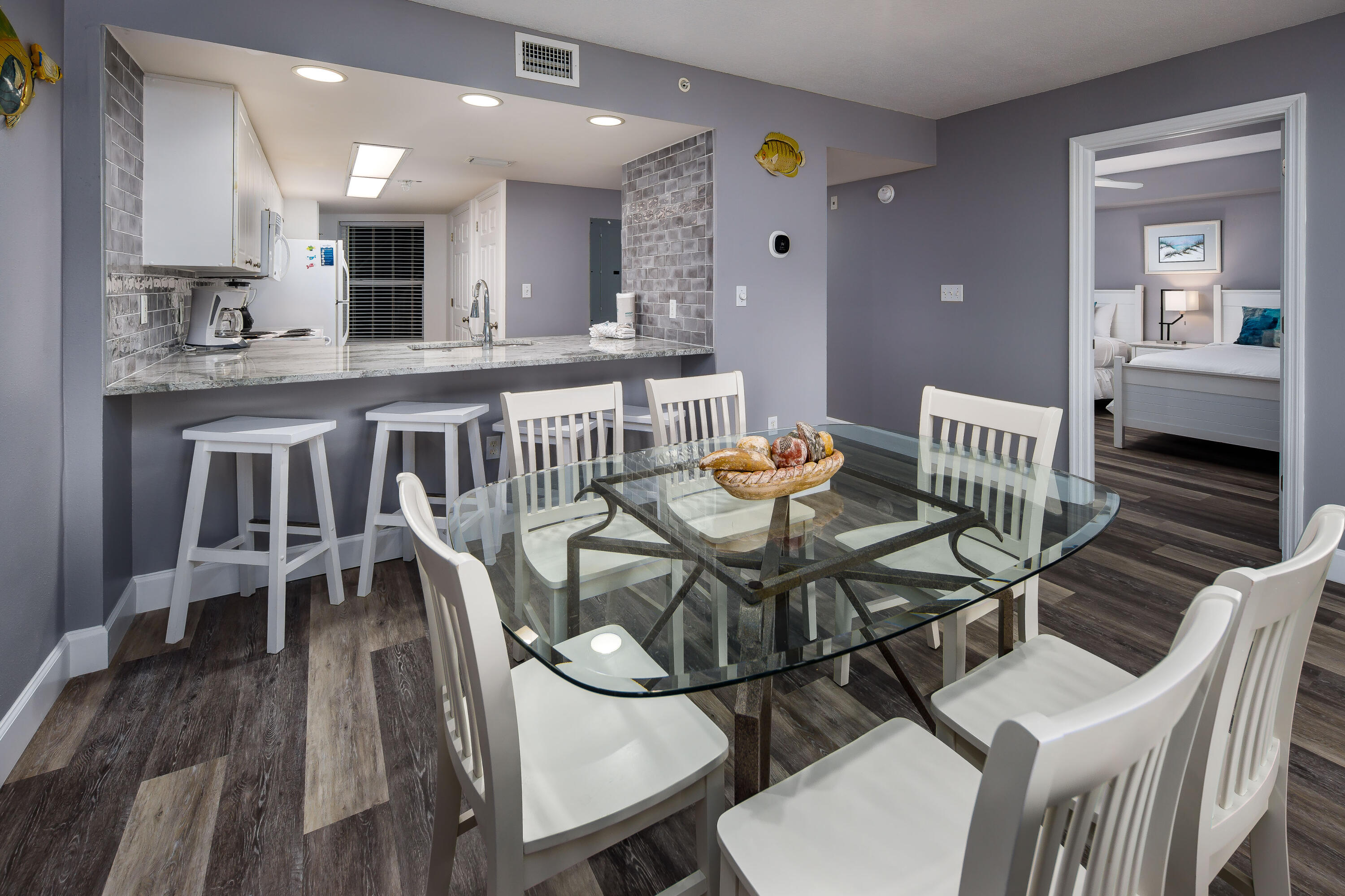 895 Santa Rosa Boulevard, Unit 208 Fort Walton Beach, FL 32548 - Photo 5 of 21 a dining room with furniture and wooden floor