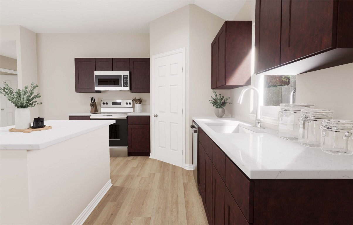 3812 Keller Road Temple, TX 76504 - Photo 6 of 18 a kitchen with a sink a counter top space and cabinets