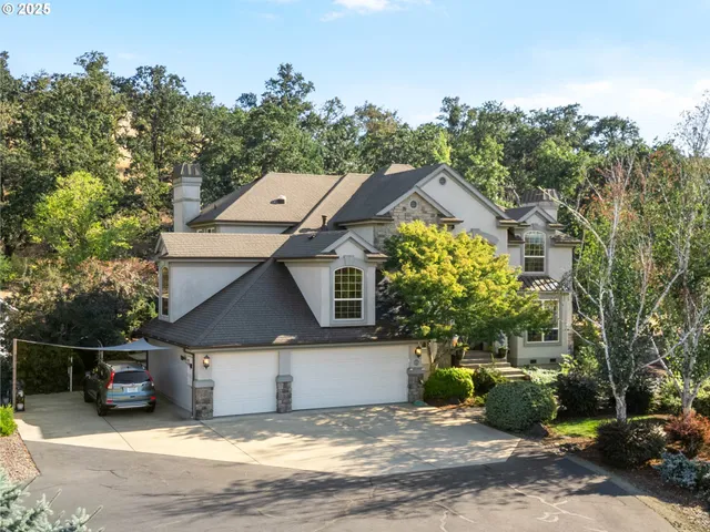 a view of a house with a garden and pathway