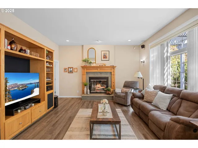 a living room with furniture a window and a fireplace