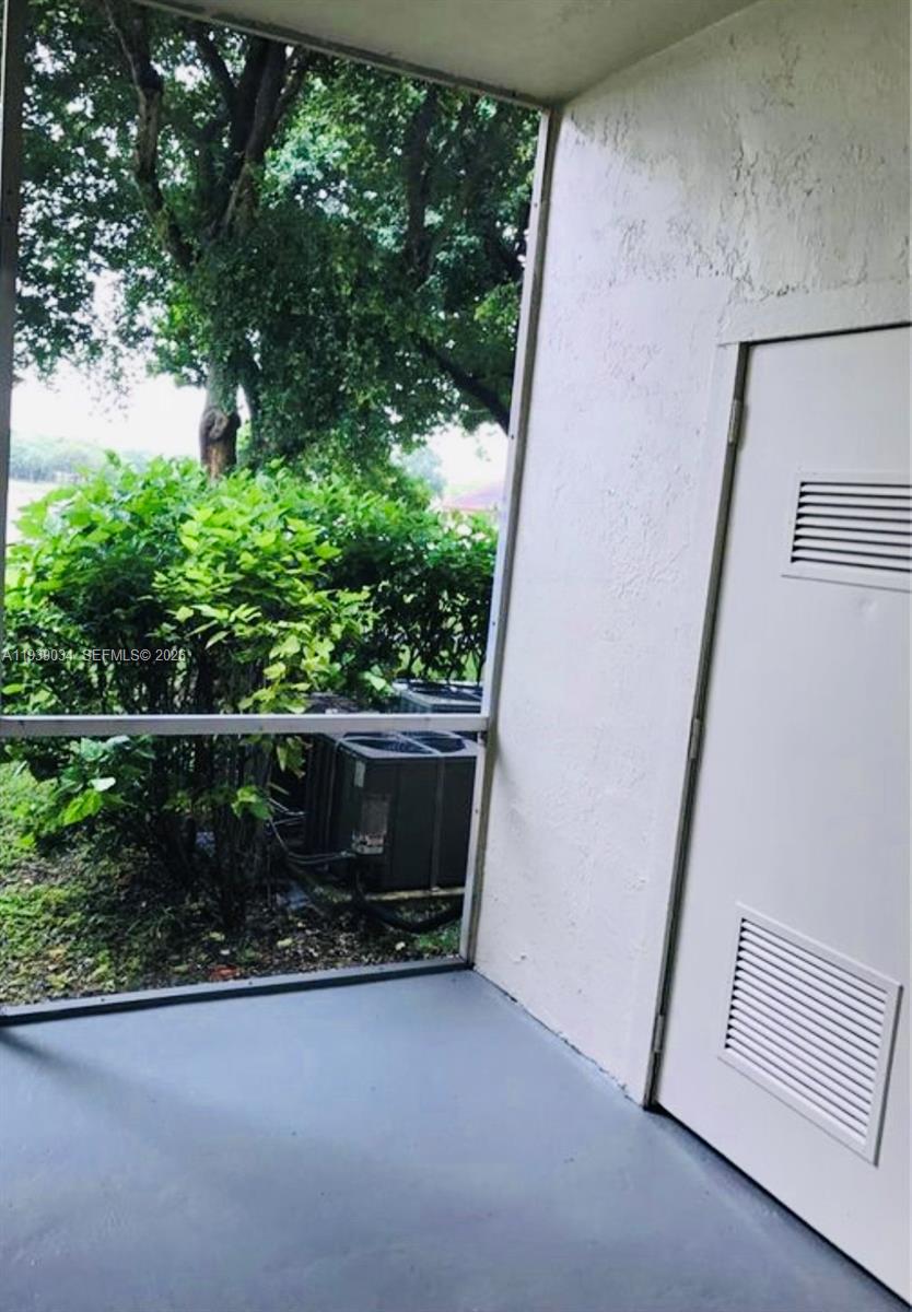 15340 Southwest 106th Terrace, Unit 819 Miami, FL 33196 - Photo 11 of 16 a view of balcony with furniture and garden