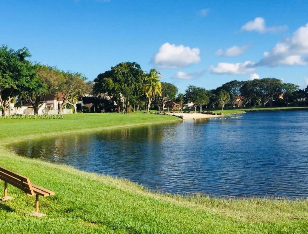 15340 Southwest 106th Terrace, Unit 819 Miami, FL 33196 - Photo 15 of 16 a view of a lake with a yard