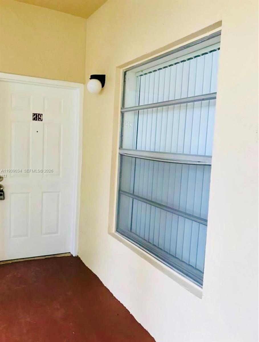 15340 Southwest 106th Terrace, Unit 819 Miami, FL 33196 - Photo 2 of 16 a view of entryway with wooden floor