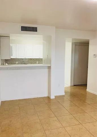 a view of a room with an empty space