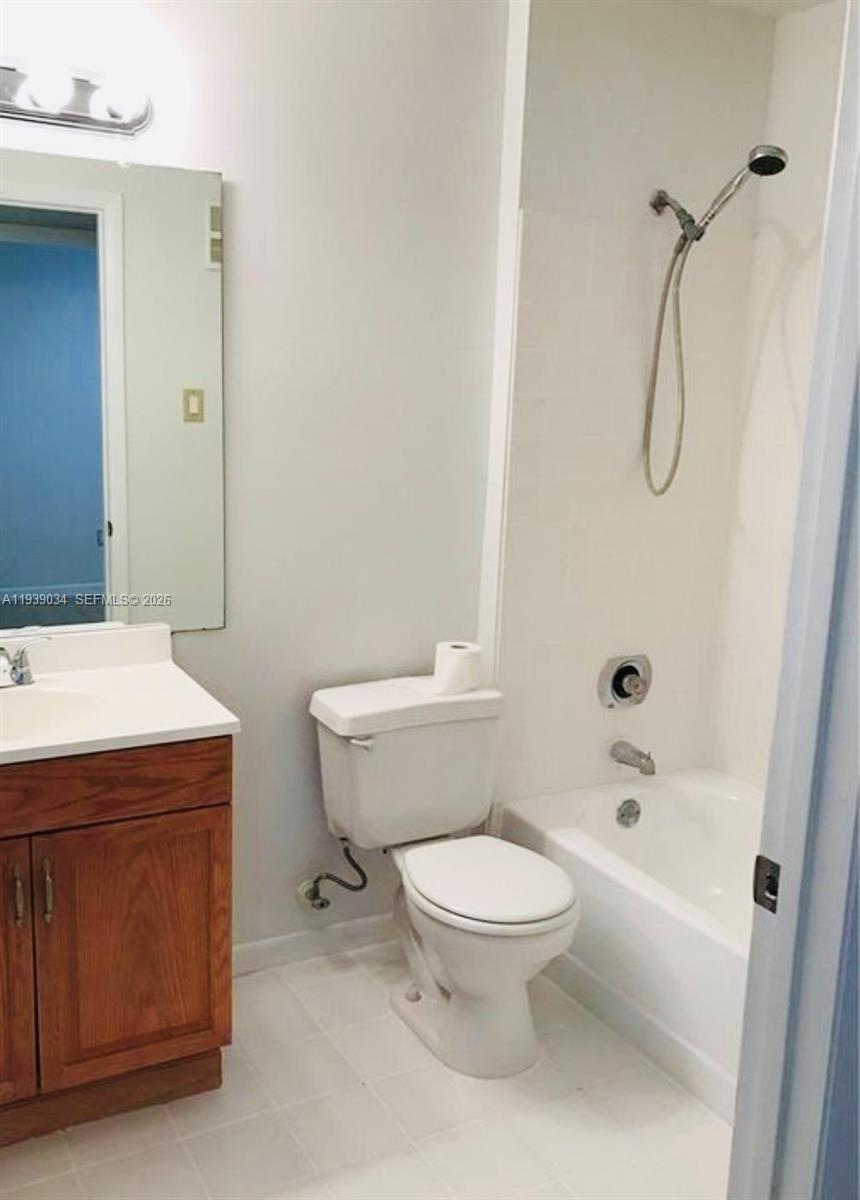 15340 Southwest 106th Terrace, Unit 819 Miami, FL 33196 - Photo 9 of 16 a bathroom with a toilet sink and shower