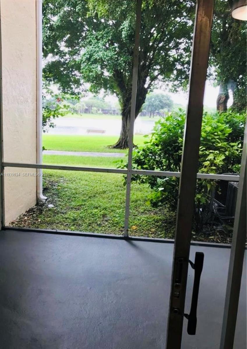 15340 Southwest 106th Terrace, Unit 819 Miami, FL 33196 - Photo 10 of 16 a view of a garden from a window