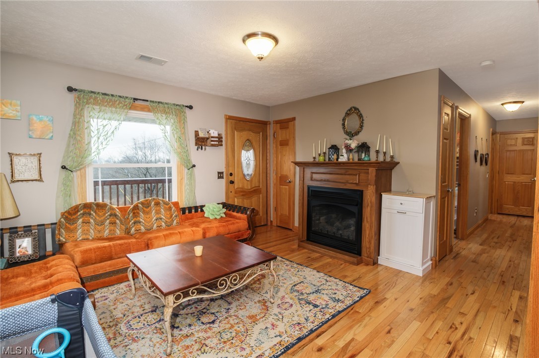 692 Tick Ridge Road Vincent, OH 45784 - Photo 6 of 40 Living room featuring light hardwood / wood-style floors