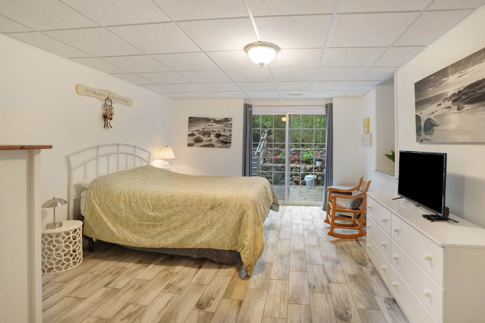 8 Fresh Pond Road Oak Bluffs, MA 02557 - Photo 26 of 40 a bedroom with a bed and a flat screen tv