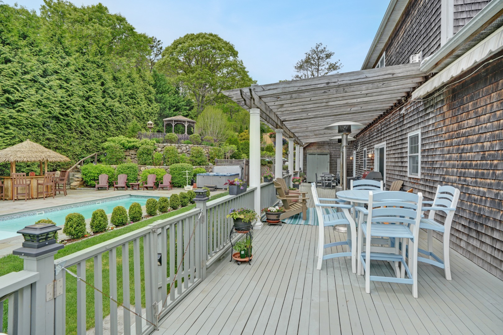 8 Fresh Pond Road Oak Bluffs, MA 02557 - Photo 33 of 40 a view of a chairs and table in the balcony