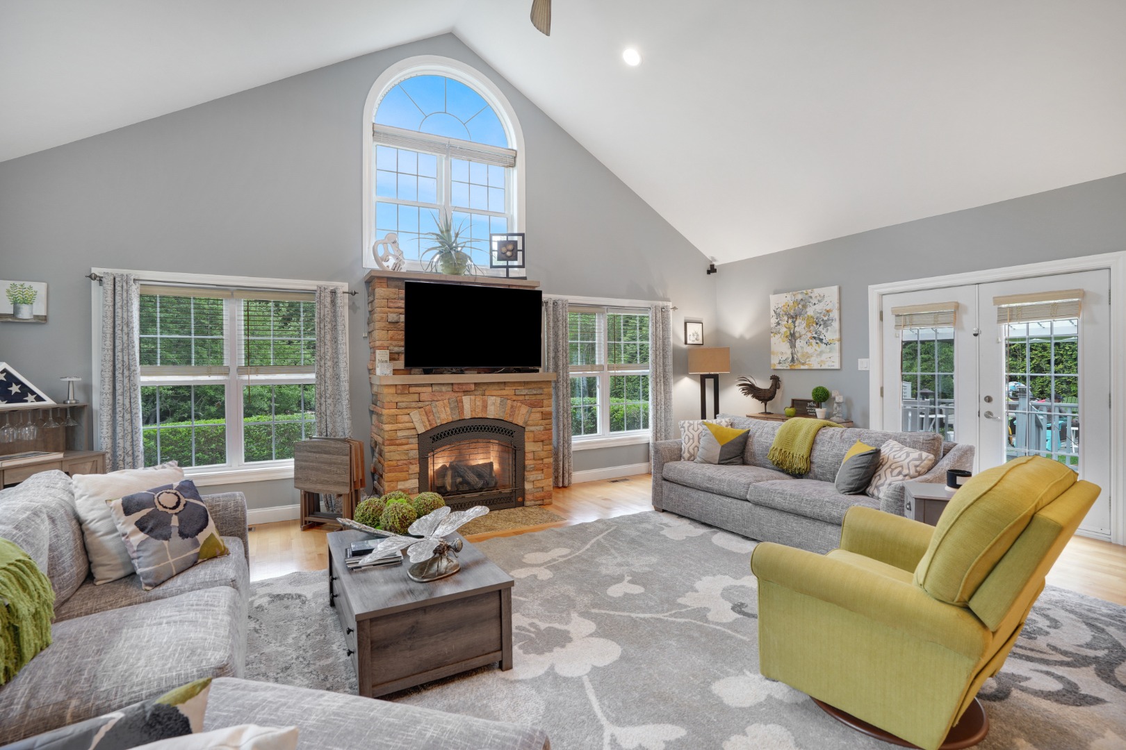 8 Fresh Pond Road Oak Bluffs, MA 02557 - Photo 7 of 40 a living room with furniture a fireplace and a flat screen tv