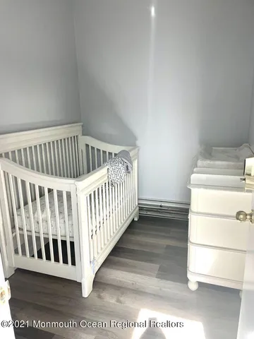 a view of a porch with wooden floor