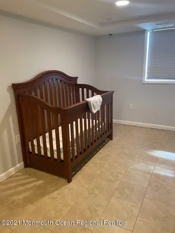 a view of bedroom with wooden floor