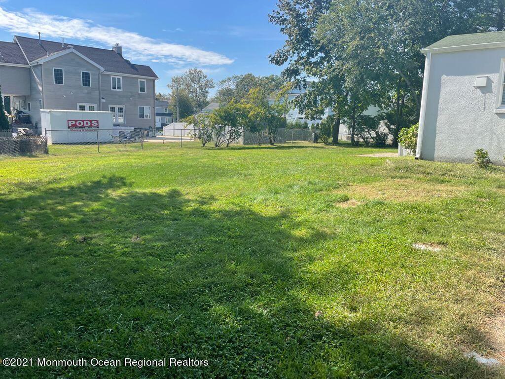 21 Berg Avenue Elberon, NJ 07740 - Photo 17 of 17 a view of a house with a big yard and large trees