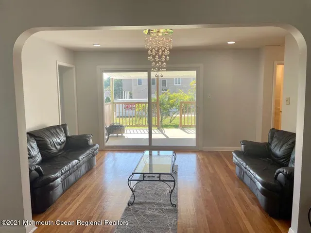a living room with furniture and a table